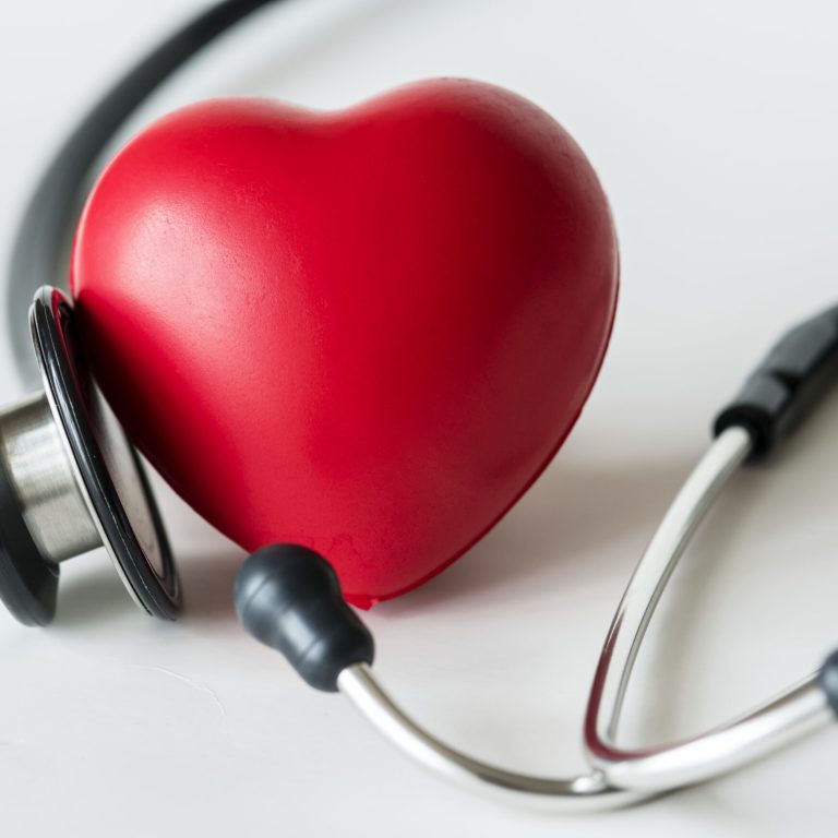 Closeup of heart and a stethoscope cardiovascular checkup concept