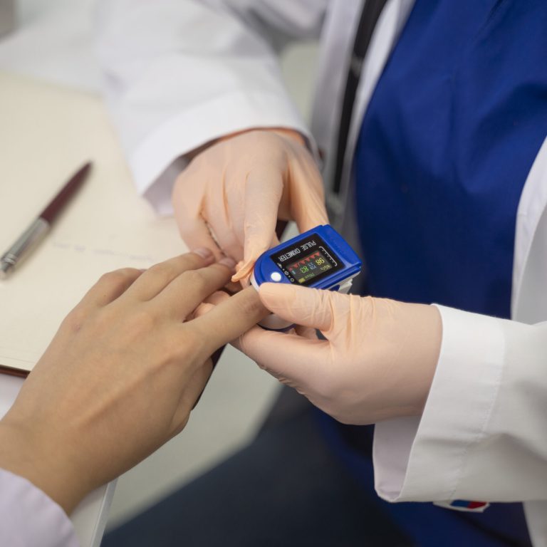 high-angle-doctor-checking-patient