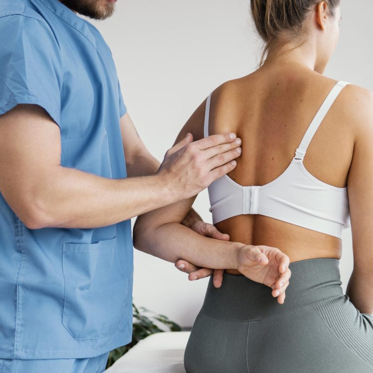side-view-male-osteopathic-therapist-checking-female-patient-s-scapula-bone